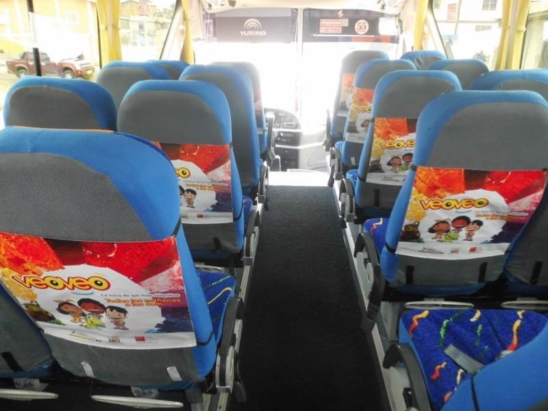 Publicidad en interior de buses en asientos